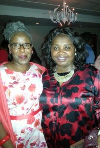 'L-R: Iyamide and Comfort at the Nostalgia Nights 'Wear Something Red' Xmas Party in December 2015